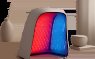 Une illustration sobre d’un appareil de lumière rouge et bleue dans un univers premium et minimaliste. L’image évoque un usage à domicile, ciblé et crédible pour le soin ou la récupération.